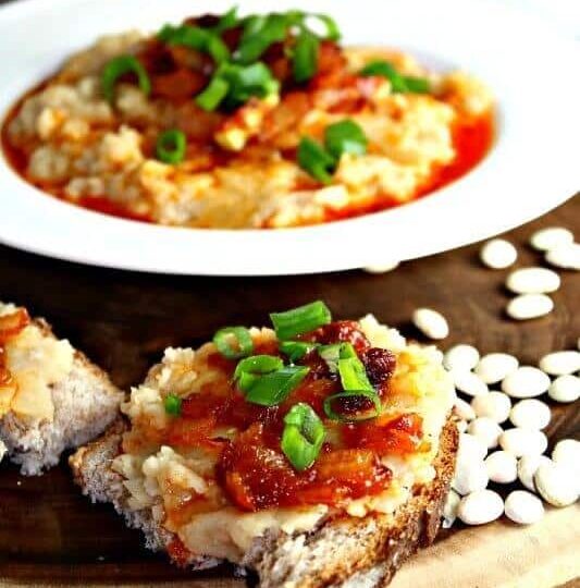 refried beans with caramelized onion in a tomato sauce