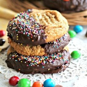 Flourless Peanut Butter Cookies are soft, dense, thick, loaded with Reese's cups, peanut M&M's and covered in chocolate!