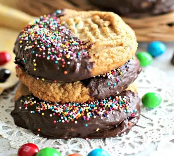 Flourless Peanut Butter Cookies are soft, dense, thick, loaded with Reese's cups, peanut M&M's and covered in chocolate!