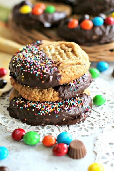 Flourless Peanut Butter Cookies are soft, dense, thick, loaded with Reese's cups, peanut M&M's and covered in chocolate! Naturally Gluten Free!