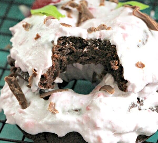 Flourless Chocolate Cake Baked Donuts are puffy and decadent, made with only 3 ingredients, and topped with raspberry coconut whipped cream
