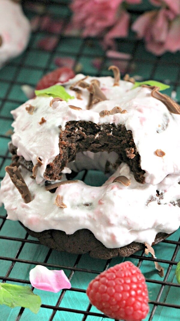 Flourless Chocolate Cake Baked Donuts are puffy and decadent, made with only 3 ingredients, and topped with raspberry coconut whipped cream