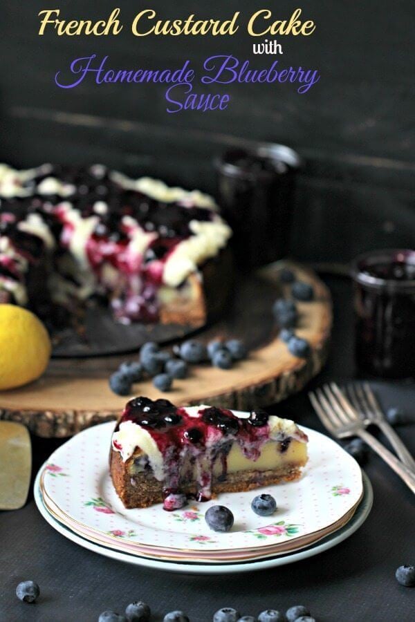 French Custard Cake with whipped cream and blueberry sauce