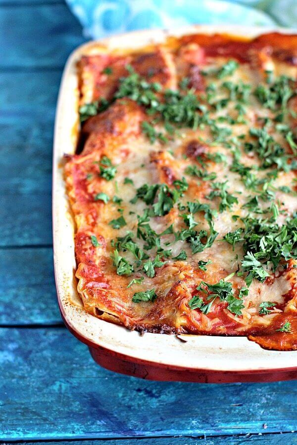 Photo of chicken lasagna in a casserole dish.