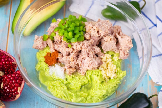 Mayo-free avocado tuna salad ingredients in a bowl.