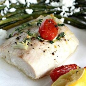 Oven Roasted Mahi Mahi in olive oil and lemon juice, served with roasted grape tomatoes and asparagus, made in just 30 minutes.