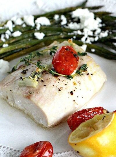 Oven Roasted Mahi Mahi in olive oil and lemon juice, served with roasted grape tomatoes and asparagus, made in just 30 minutes.