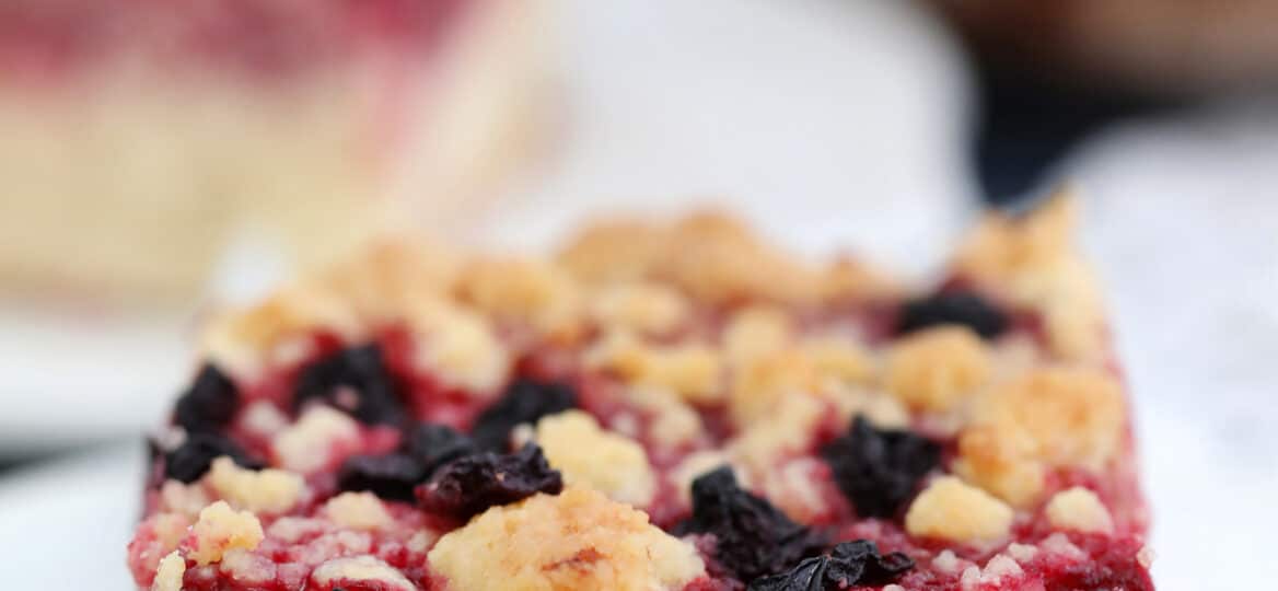 Cherry Cream Cheese Coffee Cake is made with a cake layer topped with a cheesecake filling, juicy cherries and a buttery crumb topping. #coffeecake #brunch #cherries #sweetandsavorymeals #desserts