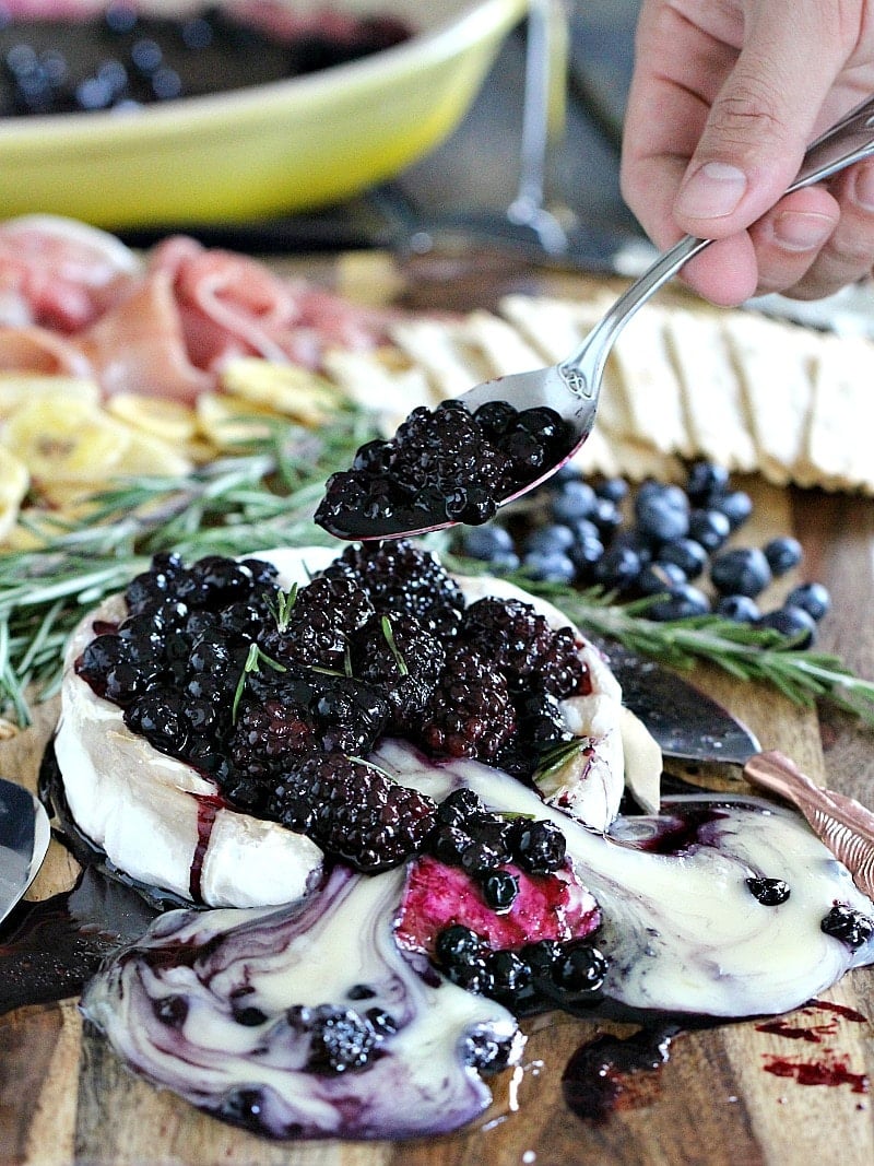 Rosemary Berry Baked Brie is a creamy and flavorful showstopper appetizer. Topped with coconut oil roasted berries and fresh rosemary.