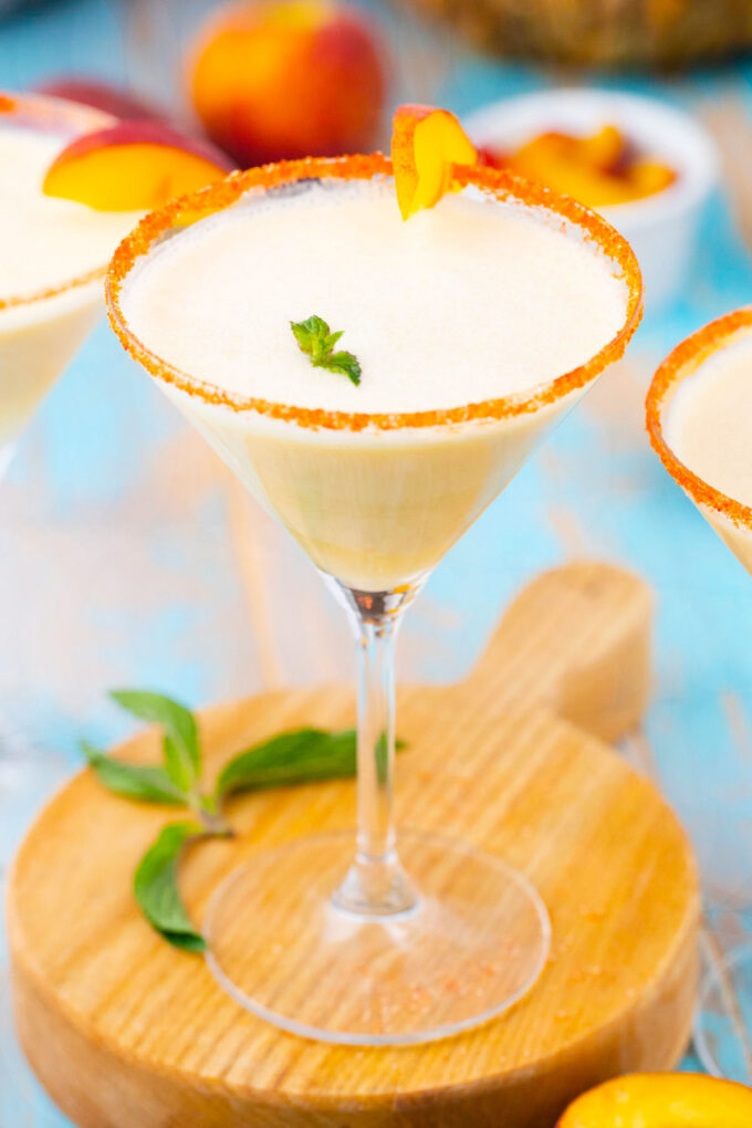 Peaches and cream martini with yellow rim.