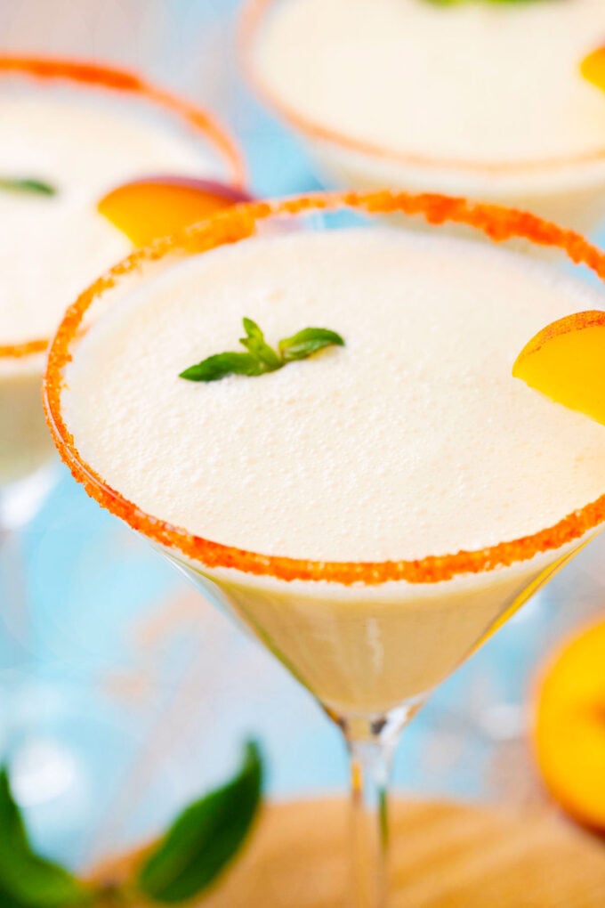 Close shot of homemade peaches and cream martini.