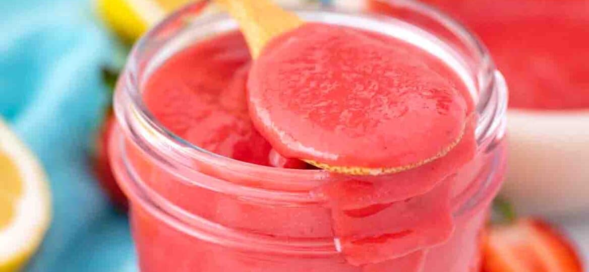 a jar filled with strawberry curd