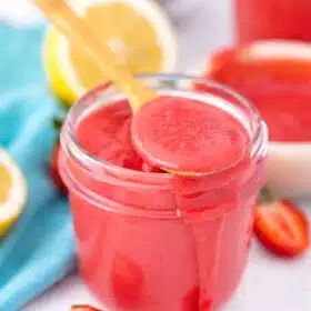 a jar filled with strawberry curd