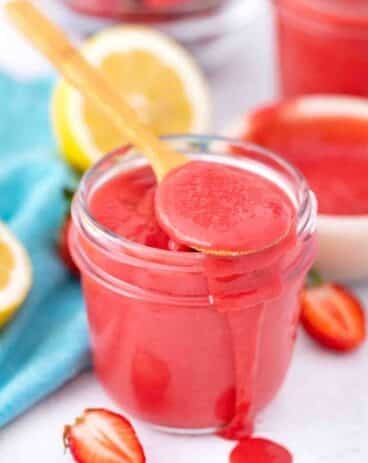 a jar filled with strawberry curd
