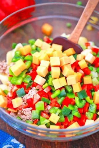 mixing ingredients for tuna pasta salad