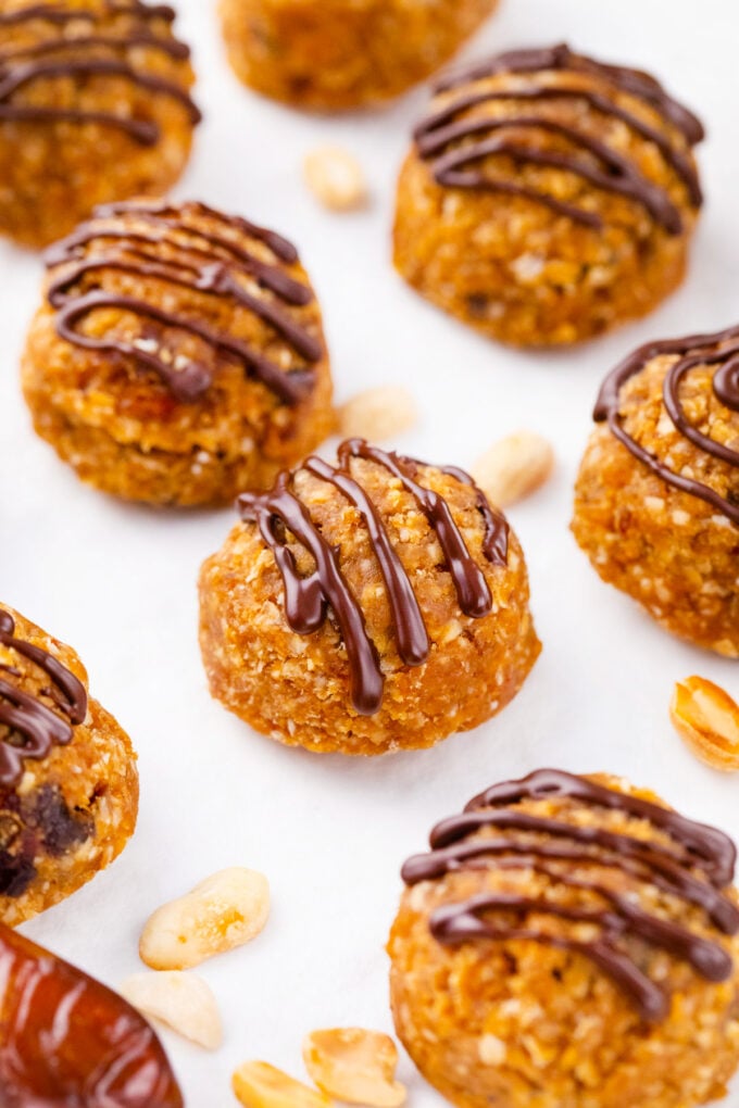 No sugar added peanut butter truffles drizzled with dark chocolate.