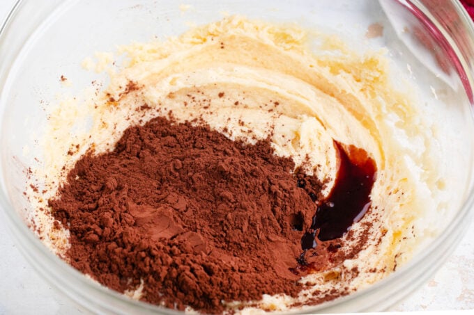 Mixing cocoa powder into cookie dough.