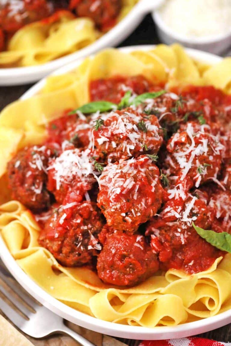 homemade Maggiano’s meatballs served in marinara sauce on top of pasta