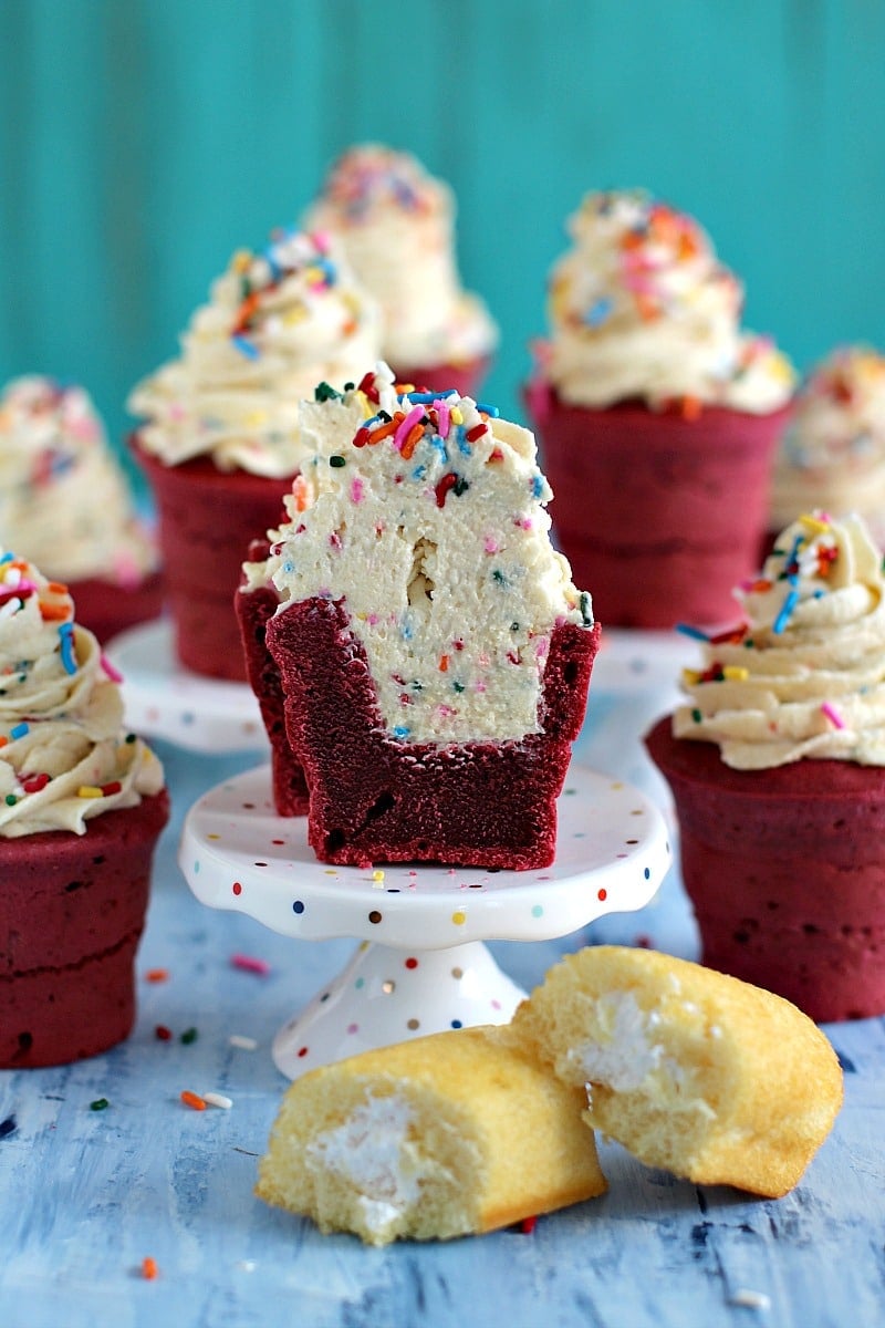 Red Velvet Cake Cone filled with a fluffy and delicious Twinkies Buttercream, made with real Twinkies and lots of sprinkles.
