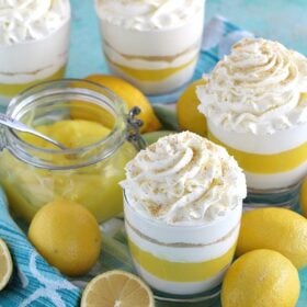 Creamy and easy to make No Bake Lemon Cheesecake layered with graham cracker crumbs, sweet and tangy lemon curd and topped with soft whipped cream.