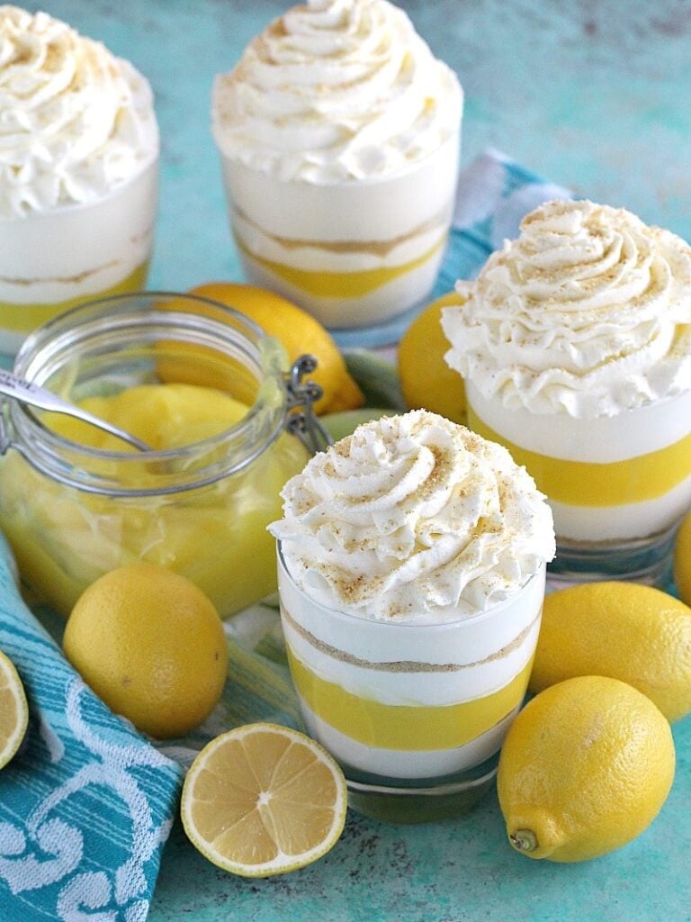 Creamy and easy to make No Bake Lemon Cheesecake layered with graham cracker crumbs, sweet and tangy lemon curd and topped with soft whipped cream.