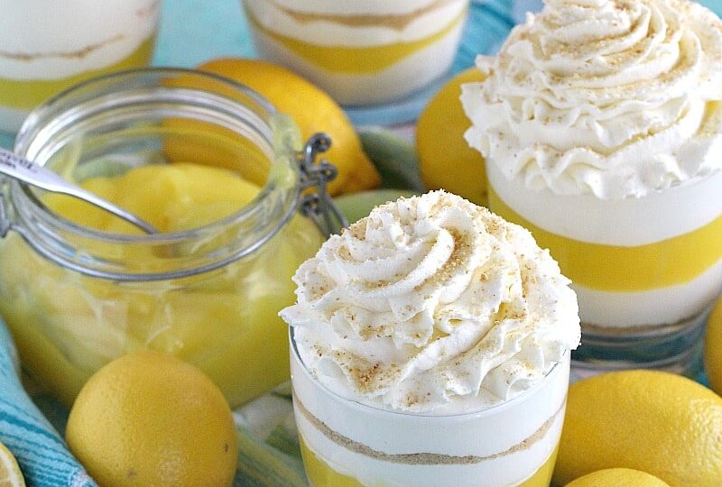 Creamy and easy to make No Bake Lemon Cheesecake layered with graham cracker crumbs, sweet and tangy lemon curd and topped with soft whipped cream.