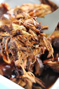 Juicy and flavorful this Pressure Cooker Pulled Pork is made quickly and easy in the Instant Pot. Flavored with beer and sweet barbecue sauce.