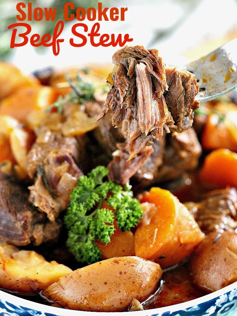 Beef stew with potatoes in a bowl garnished with chopped parsley