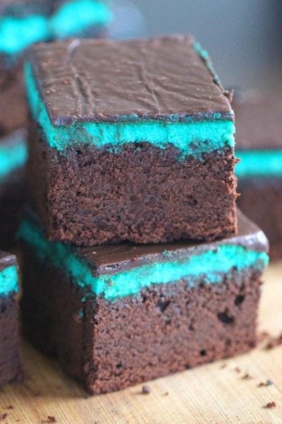 Rich and chocolaty Mint Brownies are topped with a creamy Mint Cheesecake layer and finished with a sweet layer of Chocolate Ganache.