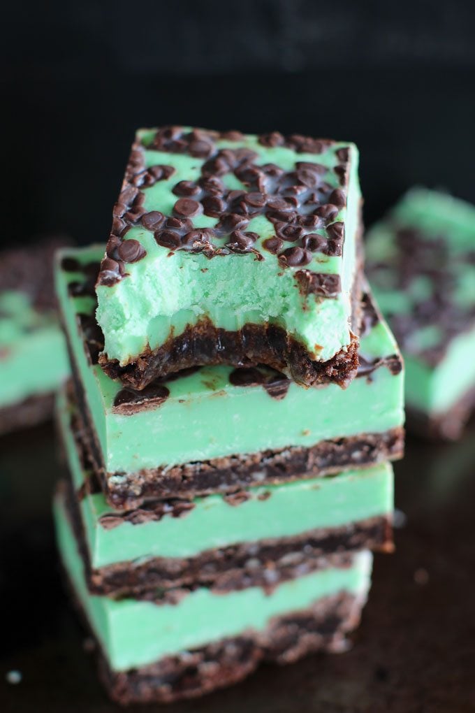 Mint Chocolate Chip Fudge with brownie layer, cut into squares and stacked