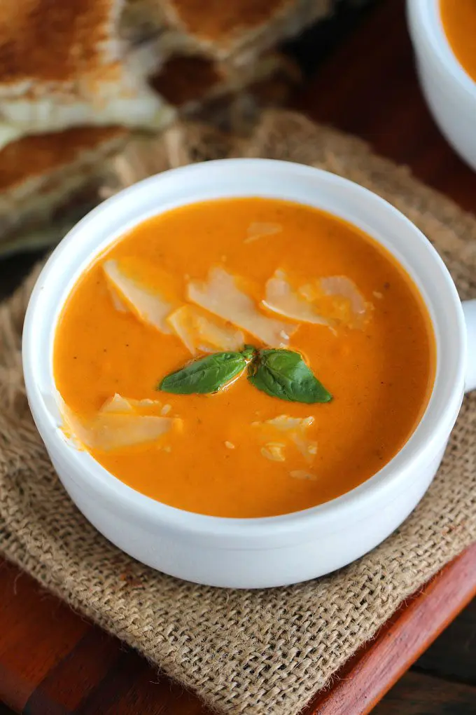 tomato soup with parmesan cheese and fresh basil