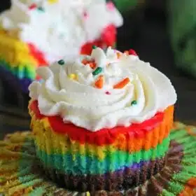 Mini Rainbow Cheesecakes are incredibly easy to make and very festive. They taste delicious and would be a fun project to do with the kids.