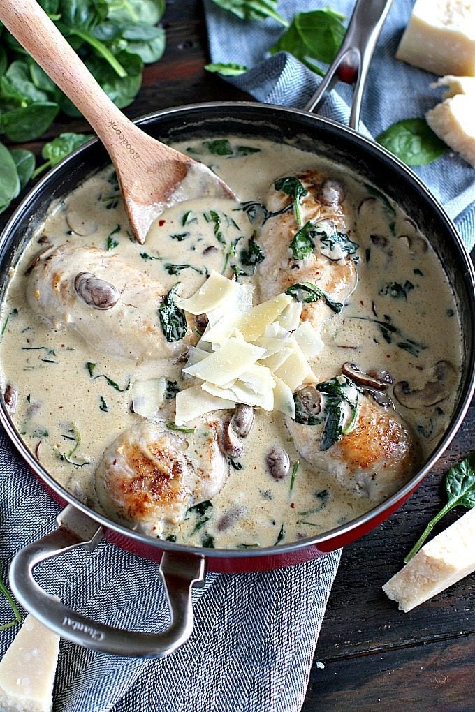 a pan of creamy parmesan mushroom chicken with spinach