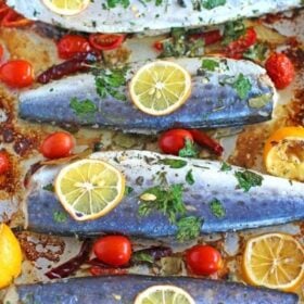 Healthy Oven Roasted Spanish Mackerel marinated with grape tomatoes, capers, dried chili peppers and lemon is one very tasty and easy meal to make.
