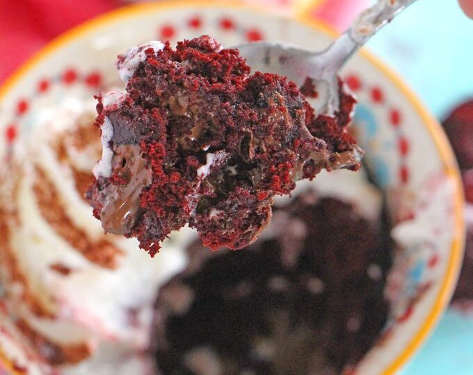 5 minutes, few ingredients and 1 bowl is what you need to make this Nutella Stuffed Red Velvet Mug Cake that has been perfectly portioned for two!