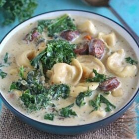 Slow Cooker Tortellini Soup that can be made in the Crockpot or Instant Pot! Creamy, loaded with chicken sausage, veggies, kale and three cheese tortellini.