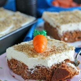 Carrot Cake Poke Cake is an incredibly easy and delicious cake made using cake mix, topped with a thick layer of mascarpone cream cheese frosting.