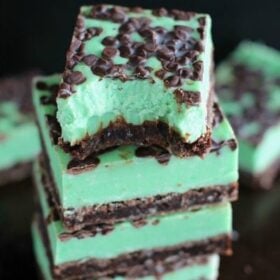 Mint Chocolate Chip Fudge over incredibly fudgy and chocolaty brownies is the best combo ever. Any mint chocolate chip fan will love this easy dessert.