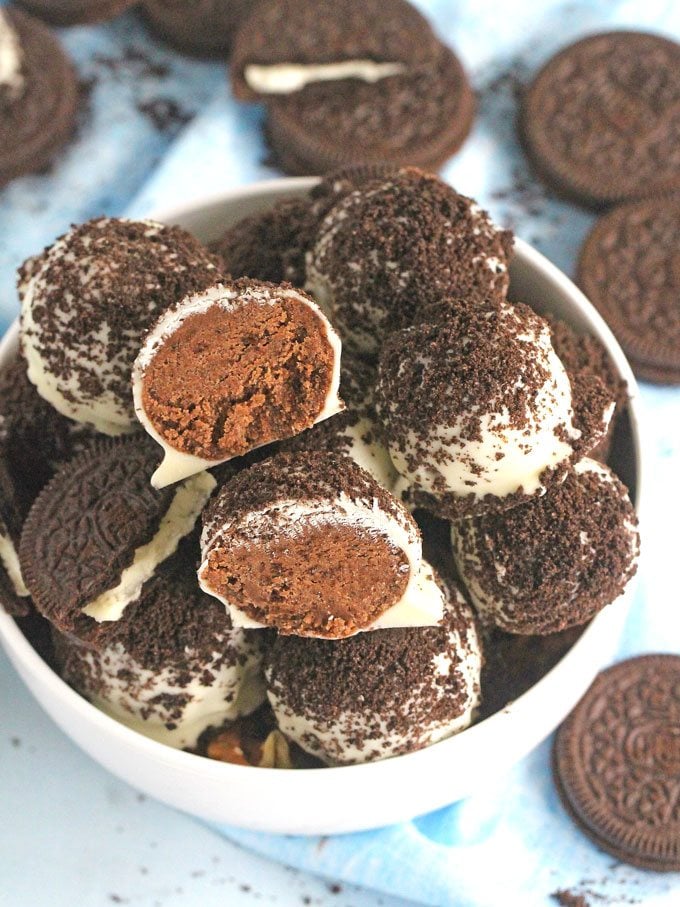 Oreo Devil's Food Cake Truffles are easy to make and no bake, loaded with chocolate cake mix, Oreos, dipped in white chocolate and topped with Oreo crumbs.