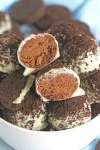 Oreo Devil's Food Cake Truffles are easy to make and no bake, loaded with chocolate cake mix, Oreos, dipped in white chocolate and topped with Oreo crumbs.