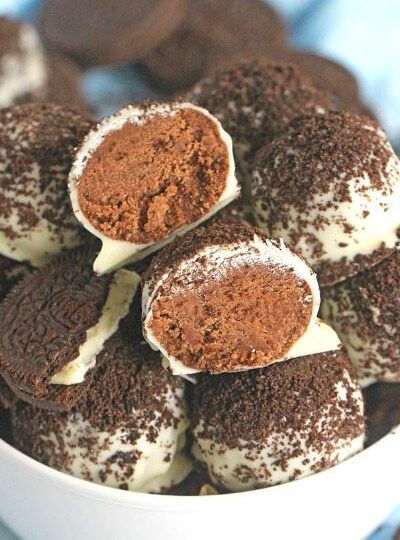 Oreo Devil's Food Cake Truffles are easy to make and no bake, loaded with chocolate cake mix, Oreos, dipped in white chocolate and topped with Oreo crumbs.