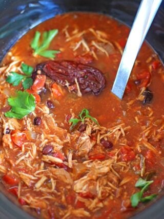 Slow Cooker Tortilla Soup is hearty and spicy, loaded with you favorite fixings, this easy to make meal is the epitome of comfort food.