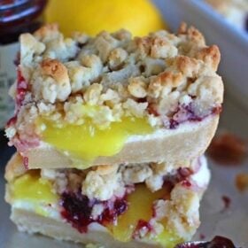 Lingonberry Bars are crumbly and buttery with a refreshing and creamy layer of lemon curd cheesecake topped with lingonberry jam and a crumb topping.