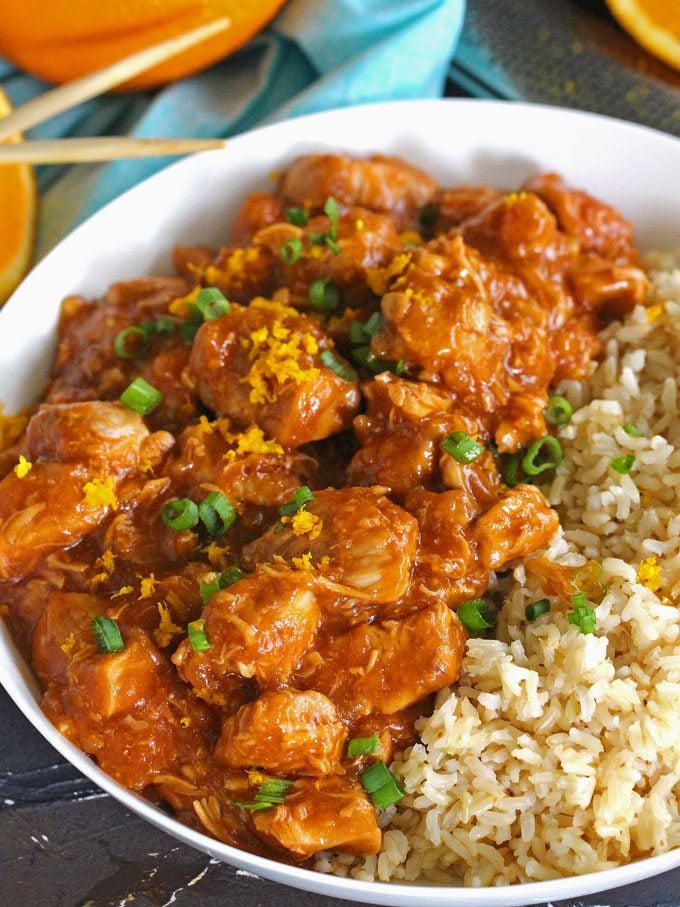 Instant pot orange chicken garnished with chopped green onion