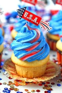 Red White and Blue Cupcakes are the perfect patriotic treat. Tasty vanilla cupcakes are topped with sweet red, white and blue buttercream swirl.