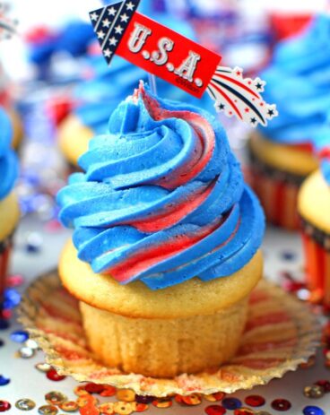 Red White and Blue Cupcakes are the perfect patriotic treat. Tasty vanilla cupcakes are topped with sweet red, white and blue buttercream swirl.