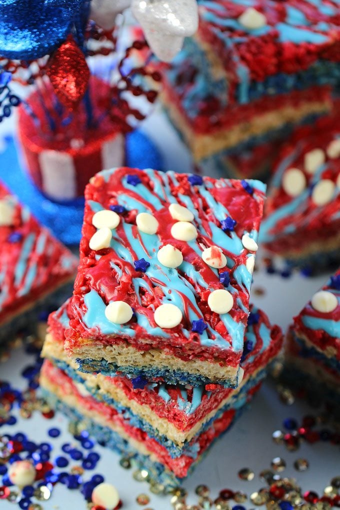 Red White and Blue Rice Krispy Treats are fluffy, sweet and no bake. Colored in red, white and blue to look extra festive and fun.