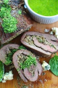 Stuffed Flank Steak with Spinach and Blue Cheese is packed with garlic, caramelized onions and walnuts.