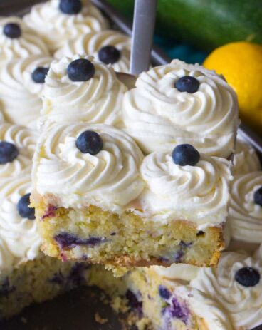 Blueberry Zucchini Poke Cake is so tender, moist and delicious. Made with zucchini, olive oil, lots of fresh lemon zest and juicy blueberries.