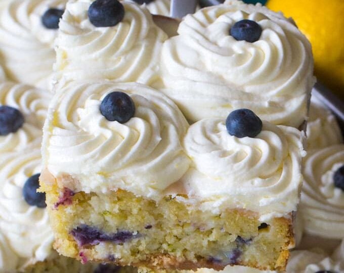 Blueberry Zucchini Poke Cake is so tender, moist and delicious. Made with zucchini, olive oil, lots of fresh lemon zest and juicy blueberries.